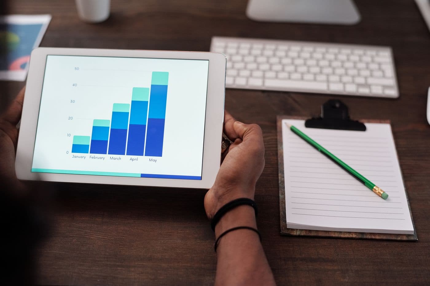 Marketer reviewing paid campaign data on a laptop
